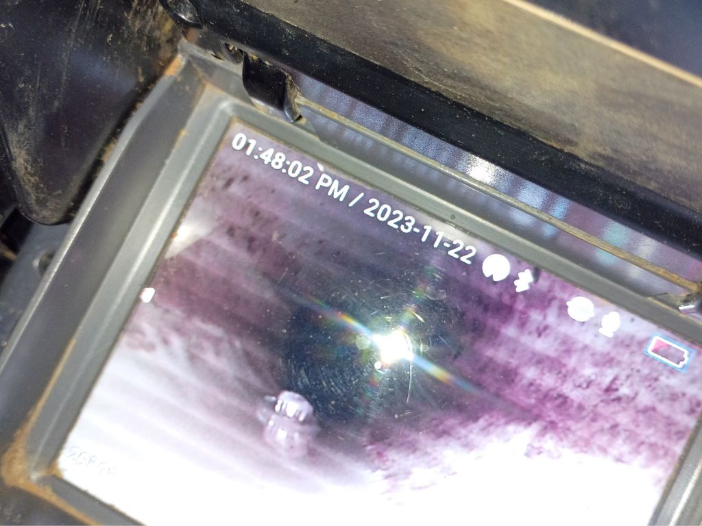 Sewer camera inspection screen showing inside an underground pipe to locate clogs, root intrusion, and plumbing damage.